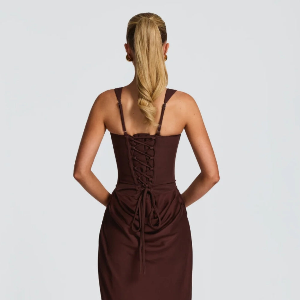 Brown gala dress styled in studio background