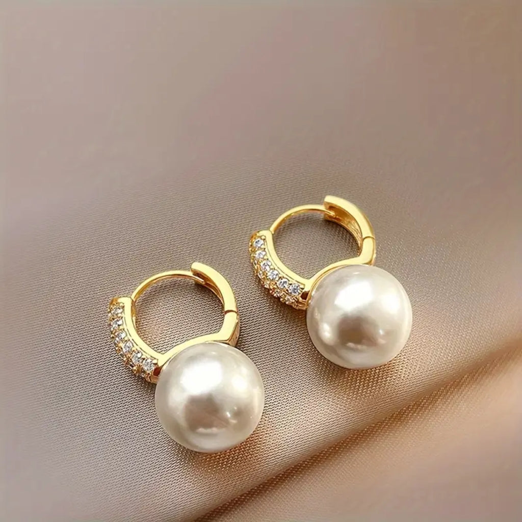 close up gold pearl drop earrings for women