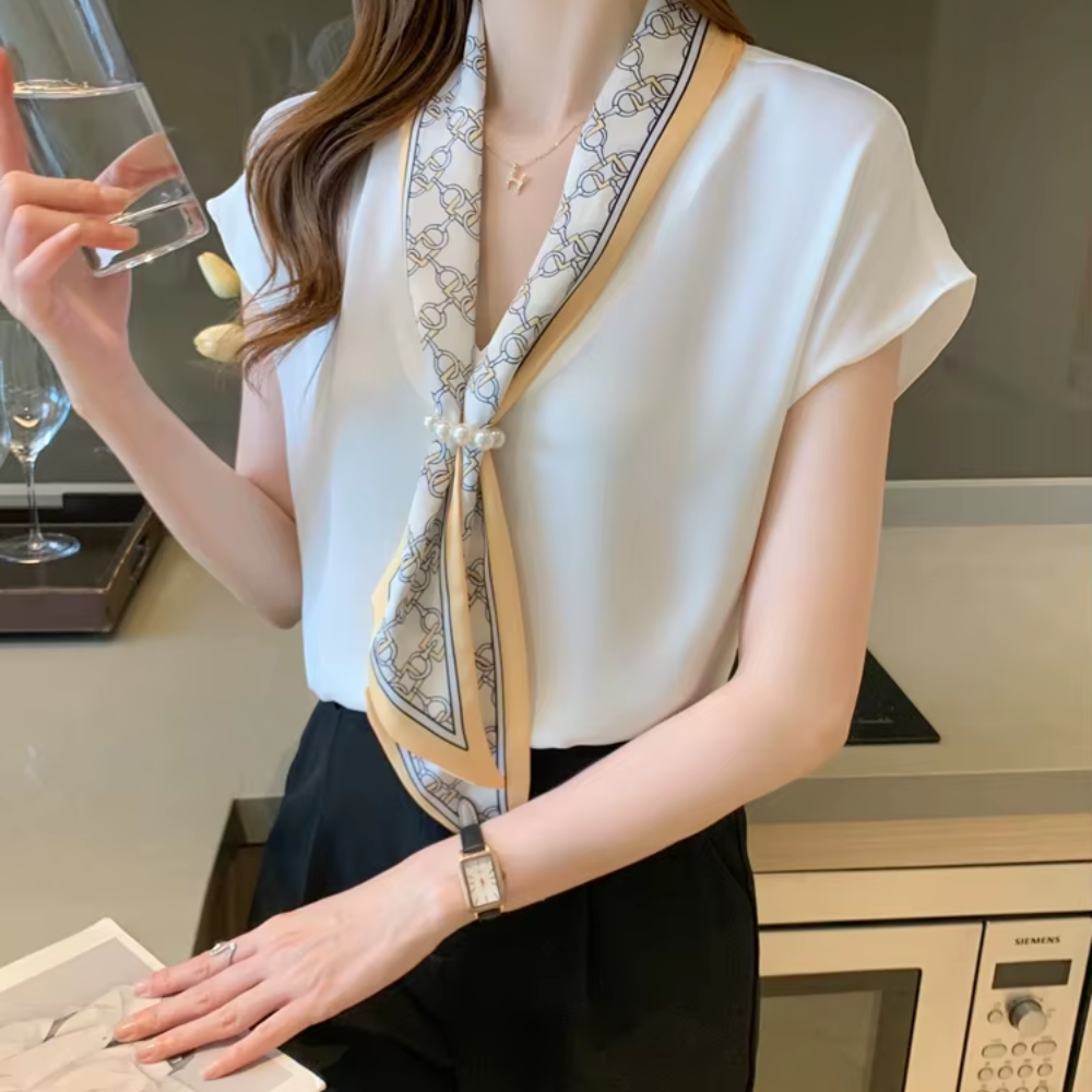 White sleeveless blouse with scarf tie neckline