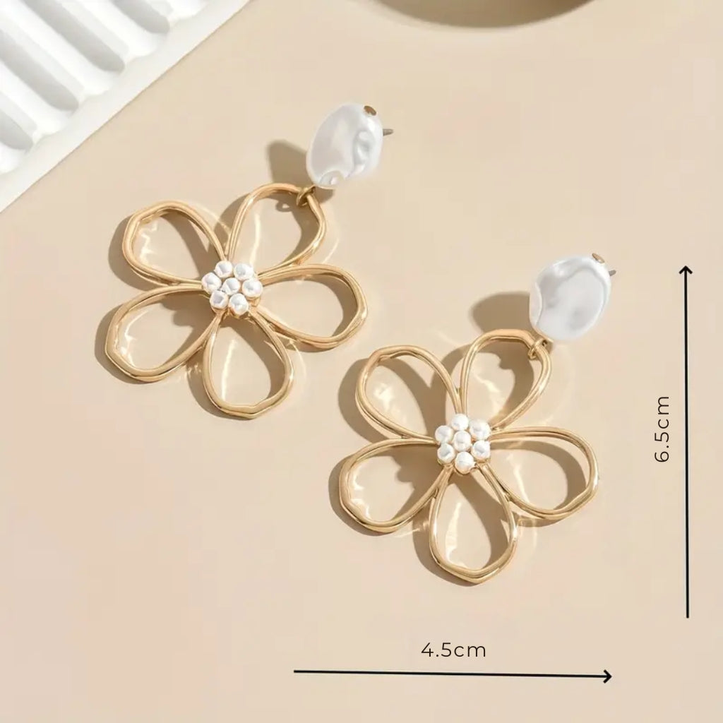 Woman wearing statement flower earrings