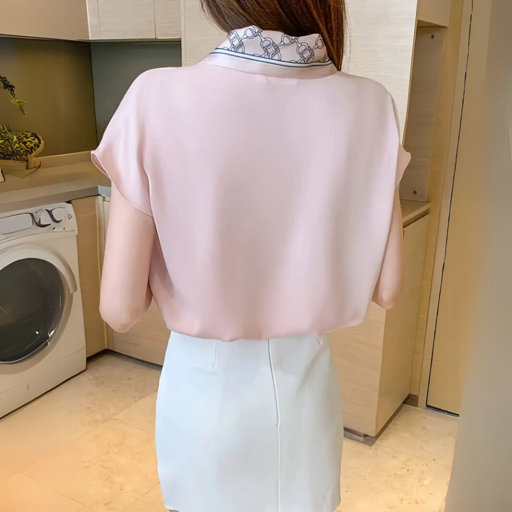 Detail view of scarf tie neckline top