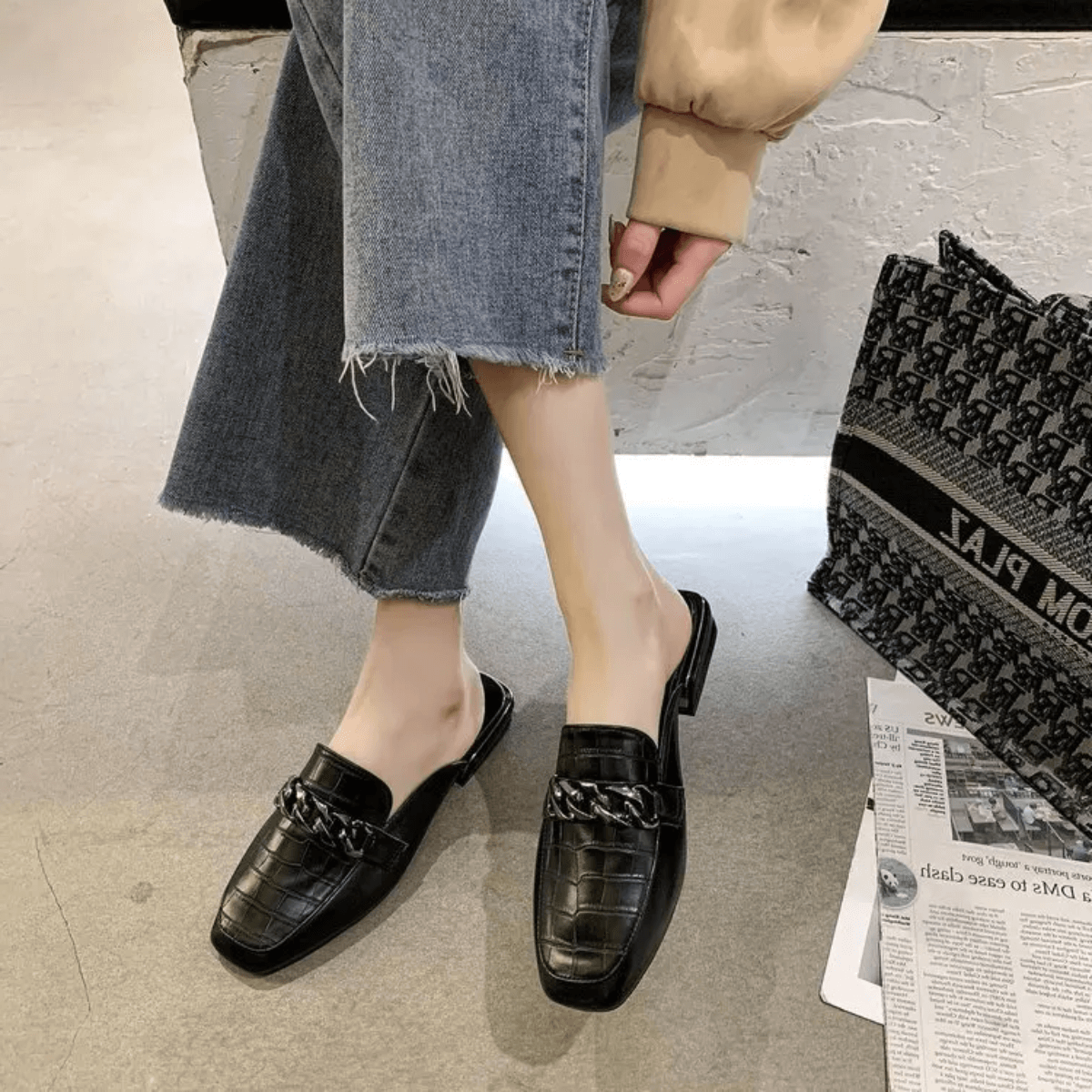 Black loafer mule side profile
