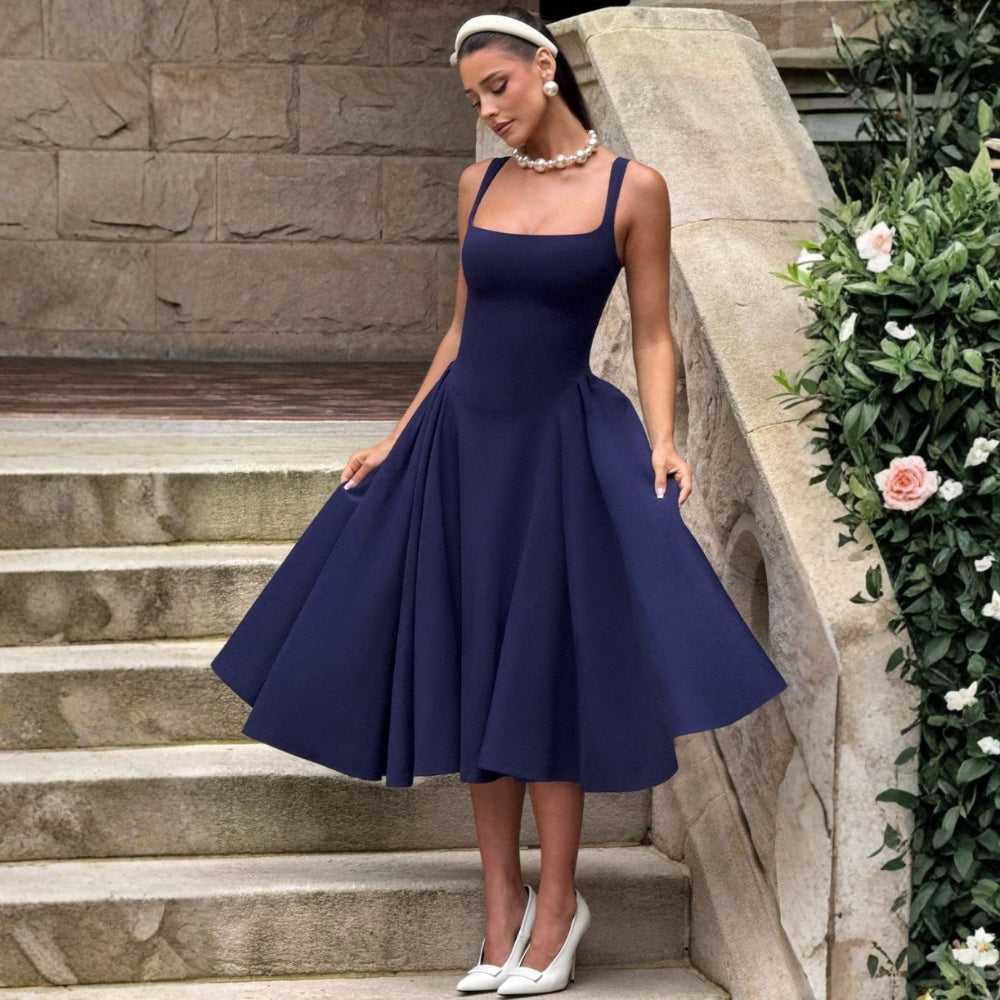 Timeless elegant midi dress photographed in outdoor setting