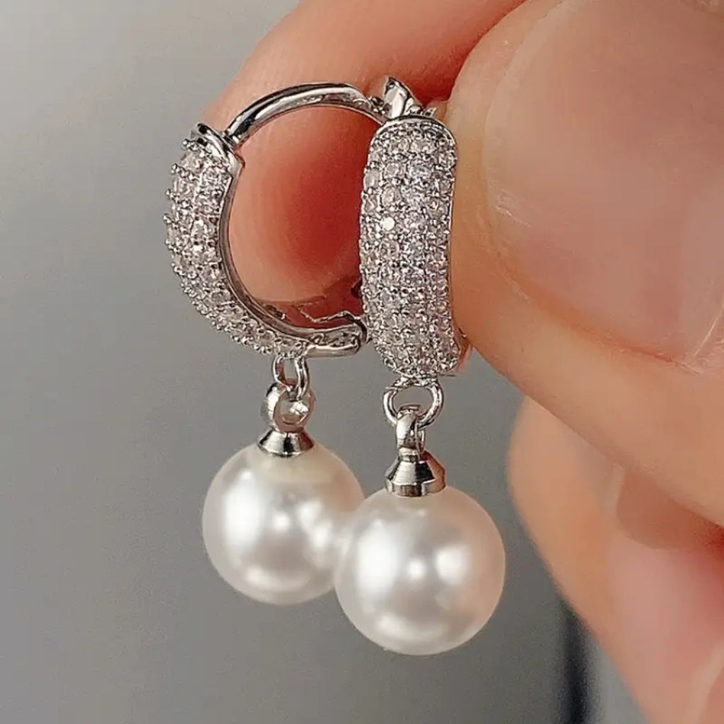 close up of pearl hoop earrings detail