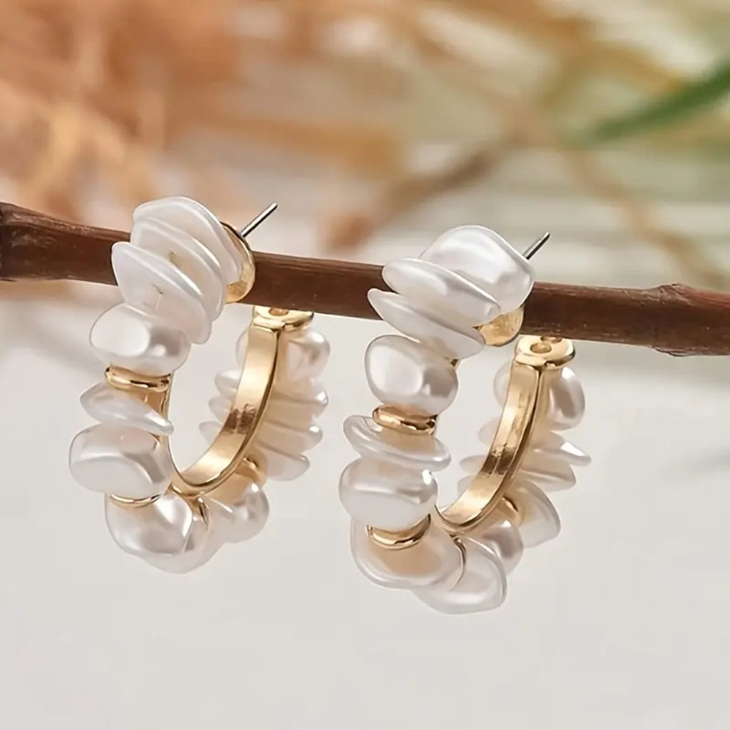 Close up pearl hoop earrings