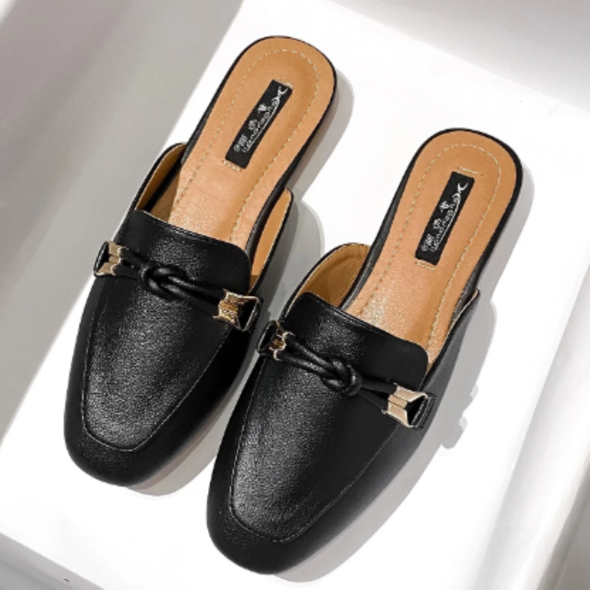 Black loafer style mule front view
