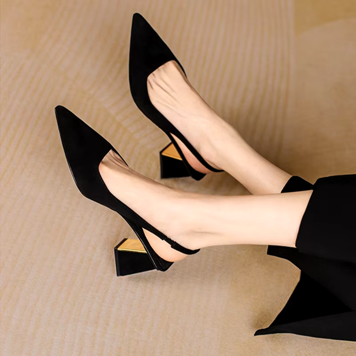 Black pointed mid heel mule side view