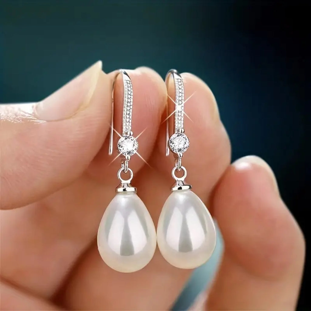 close up of pearl drop earrings detail