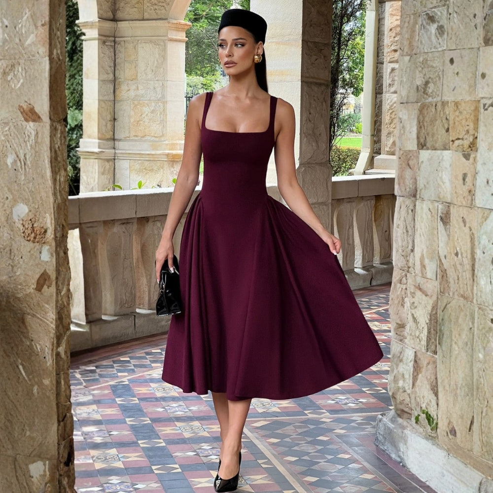 Elegant fit and flare midi dress styled outdoors on stairs